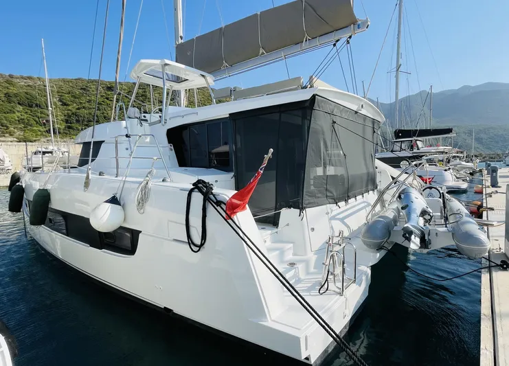  Yacht Photos Pics 2022 Bali 4.4 catamaran docked at marina, featuring sleek design and modern amenities.