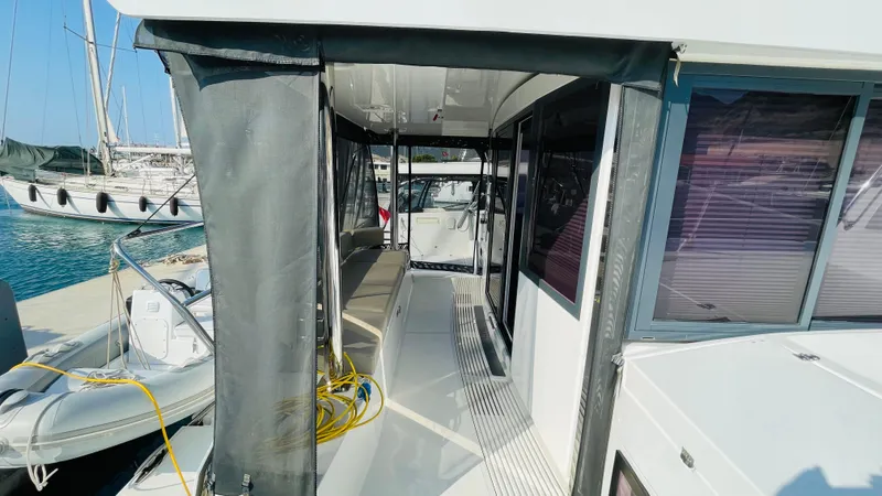  Yacht Photos Pics Modern Bali 4.4 yacht deck with seating, docked at marina, 2022 model.