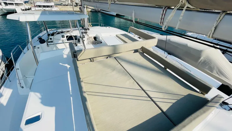  Yacht Photos Pics Luxurious Bali 4.4 catamaran deck, 2022 model, featuring spacious seating and helm, docked at marina.