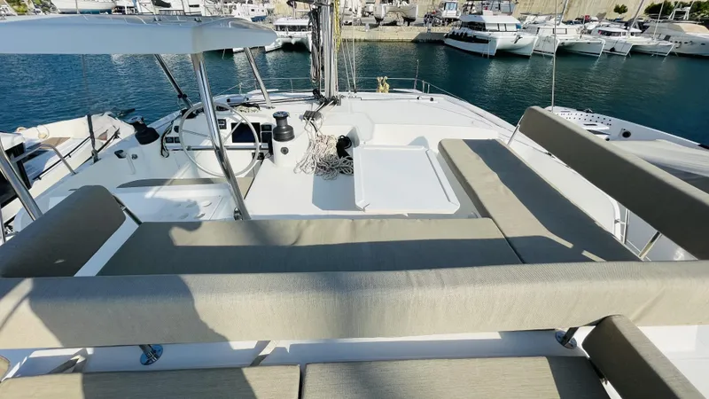  Yacht Photos Pics Luxurious 2022 Bali 4.4 yacht deck with seating, docked at marina.