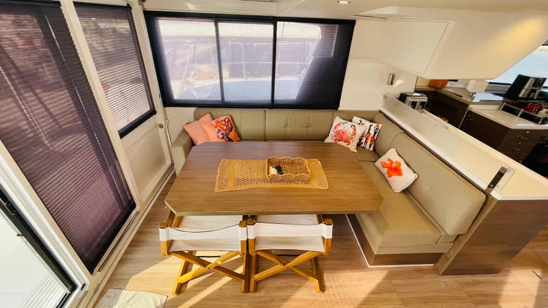  Yacht Photos Pics Interior of 2022 Bali 4.4 yacht with cozy dining area and stylish decor.