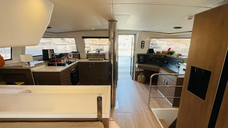  Yacht Photos Pics Modern interior of a 2022 Bali 4.4 yacht with kitchen and navigation area.