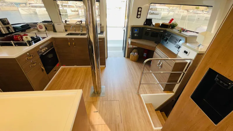  Yacht Photos Pics Interior of a 2022 Bali 4.4 yacht with modern kitchen and navigation area.