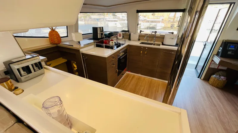  Yacht Photos Pics Modern kitchen interior on a 2022 Bali 4.4 yacht, featuring sleek countertops and appliances.