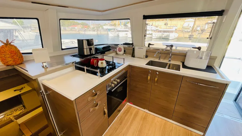  Yacht Photos Pics Modern kitchen interior on a 2022 Bali 4.4 yacht, featuring sleek countertops and appliances.