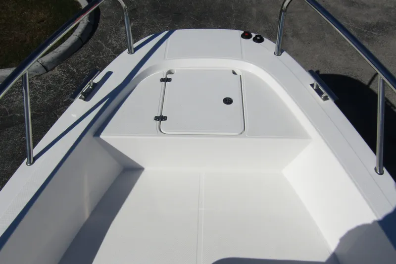  Yacht Photos Pics 2025 Nimbus Tender 9 boat deck with storage compartment and stainless steel railings.