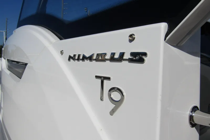  Yacht Photos Pics Close-up of 2025 Nimbus Tender 9 boat logo on white hull.