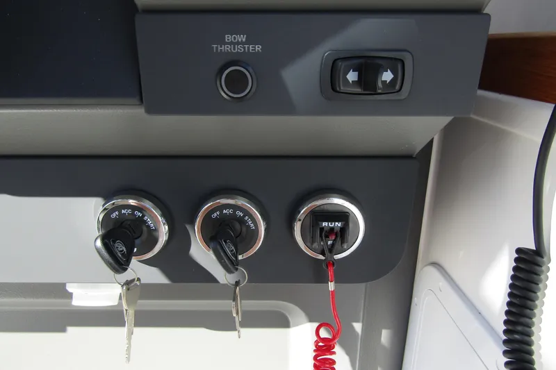  Yacht Photos Pics Control panel of 2025 Nimbus Tender 9 with ignition keys and bow thruster switch.