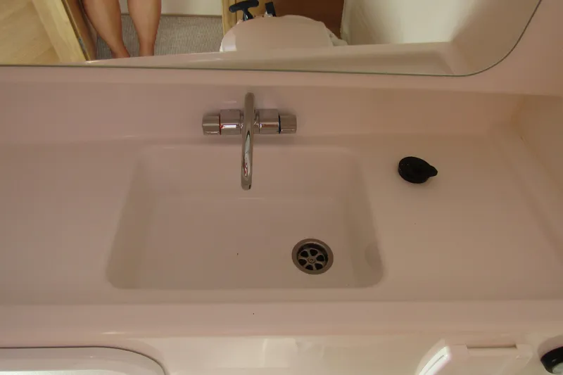  Yacht Photos Pics Sink area in 2025 Nimbus Tender 9 boat, featuring a modern faucet and drain.