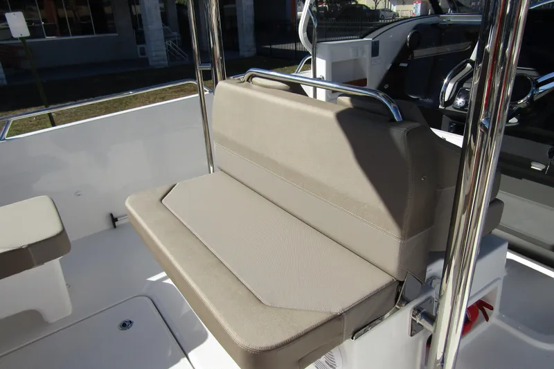  Yacht Photos Pics 2025 Nimbus Tender 9 boat seat with beige upholstery and chrome accents.