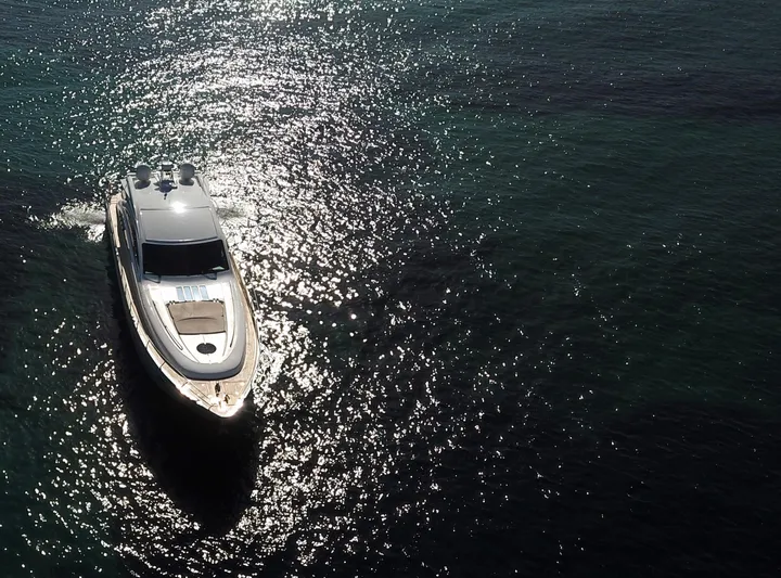  Yacht Photos Pics Luxury 2006 Princess V70 yacht cruising on sparkling water.