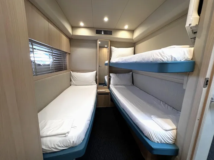  Yacht Photos Pics Compact cabin with bunk beds in a 2006 Princess V70 yacht.