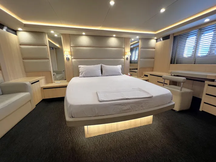  Yacht Photos Pics Luxurious bedroom interior of 2006 Princess V70 yacht with modern design and ambient lighting.