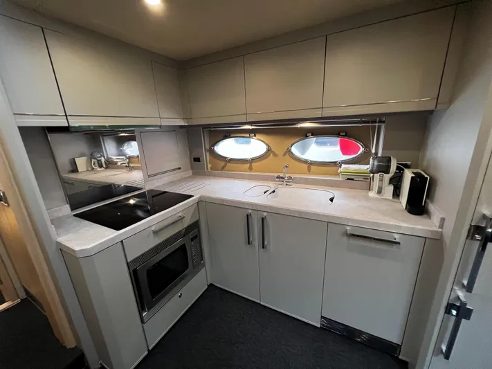  Yacht Photos Pics Modern kitchen in 2006 Princess V70 yacht with sleek cabinetry and appliances.