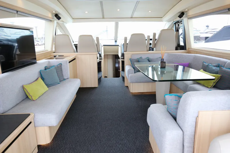 Yacht Photos Pics Luxurious interior of a 2006 Princess V70 yacht with modern seating and decor.