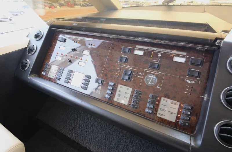  Yacht Photos Pics Control panel of a 2006 Princess V70 yacht with various switches and displays.