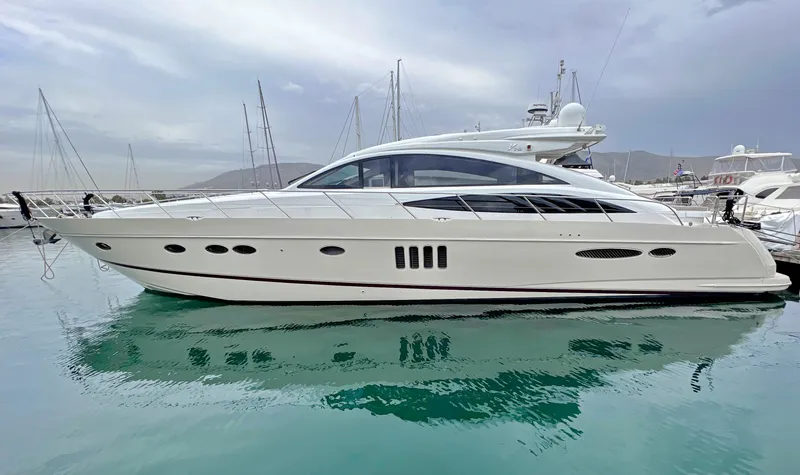  Yacht Photos Pics Luxury 2006 Princess V70 yacht docked in a serene marina setting.