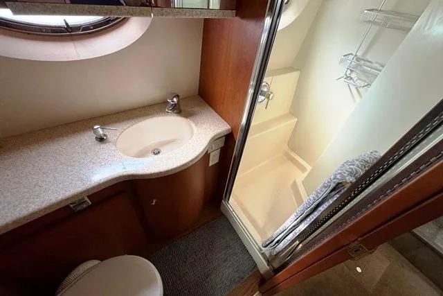  Yacht Photos Pics 2004 Silverton 35 MY Aft Cabin Motoryacht bathroom with sink, shower, and toilet.