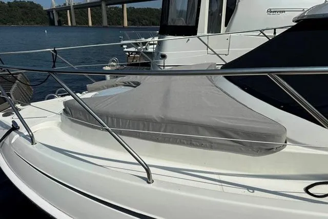  Yacht Photos Pics 2004 Silverton 35 MY Aft Cabin Motoryacht on water, featuring sleek design and covered deck.