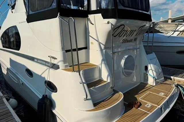  Yacht Photos Pics 2004 Silverton 35 MY Aft Cabin Motoryacht docked, featuring elegant design and spacious deck.