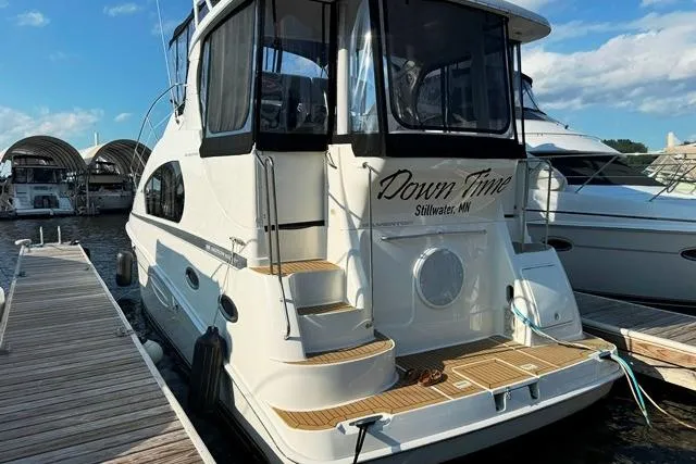  Yacht Photos Pics 2004 Silverton 35 MY Aft Cabin Motoryacht docked, featuring "Down Time" name.