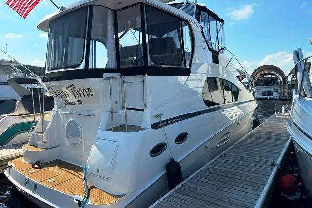  Yacht Photos Pics 2004 Silverton 35 MY Aft Cabin Motoryacht docked at marina.