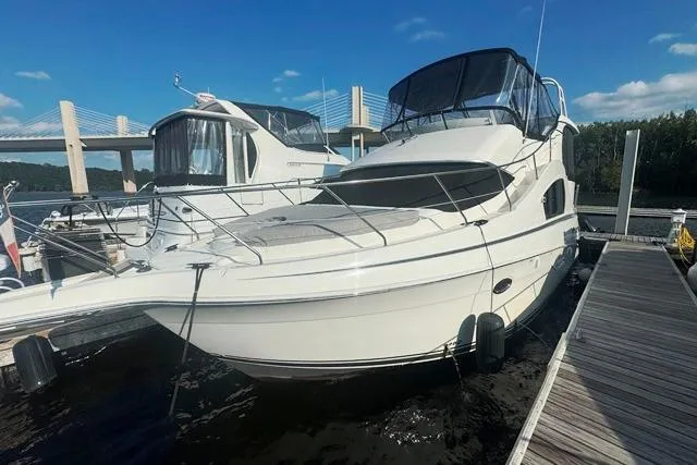  Yacht Photos Pics 2004 Silverton 35 MY Aft Cabin Motoryacht docked at marina under clear sky.