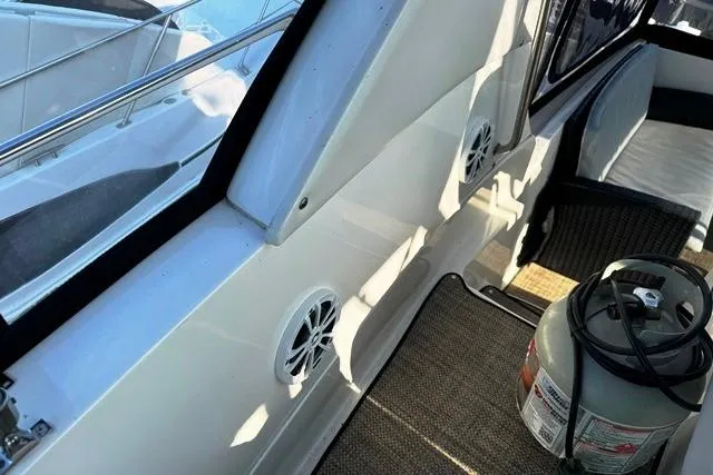  Yacht Photos Pics 2004 Silverton 35 MY Aft Cabin Motoryacht interior with seating and propane tank.