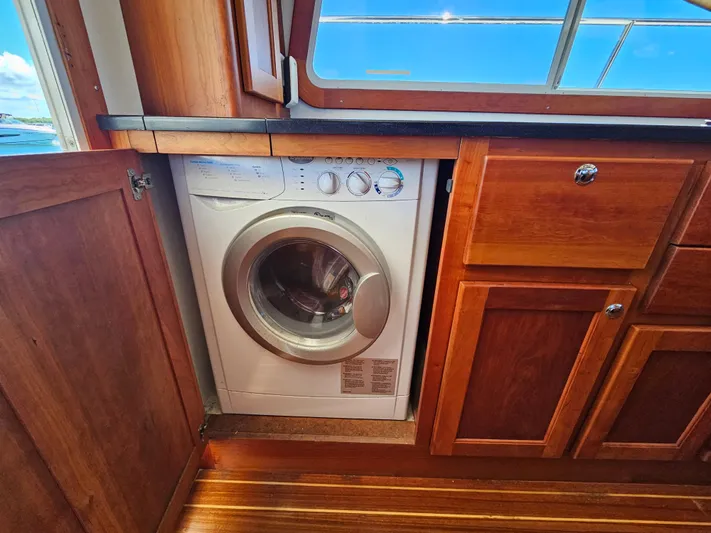 Audrey Louisa Yacht Photos Pics Washing machine in the wooden interior of a 2012 Maine Cat Power Cat 47.