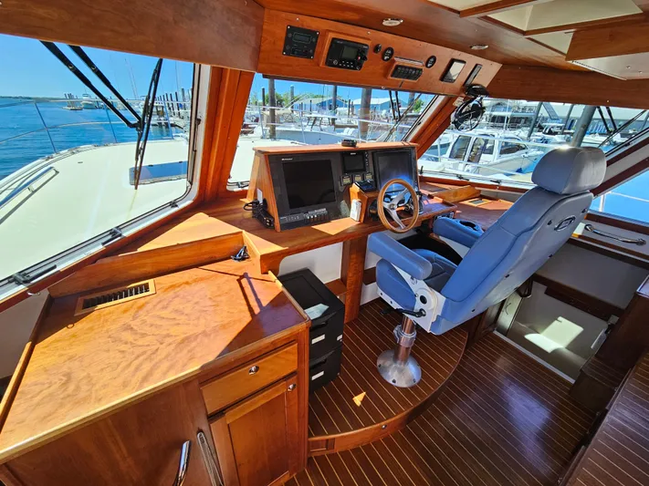 Audrey Louisa Yacht Photos Pics 2012 Maine Cat Power Cat 47 helm station with panoramic windows and modern navigation equipment.