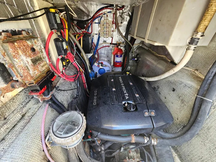 Audrey Louisa Yacht Photos Pics Engine compartment of a 2012 Maine Cat Power Cat 47 with visible wiring and components.