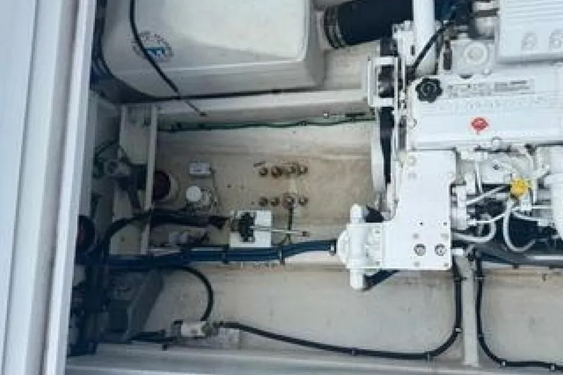  Yacht Photos Pics Engine compartment of a 2019 OceanPro 35 boat, showcasing mechanical components and wiring.