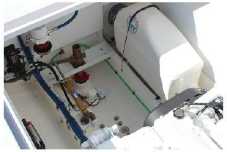  Yacht Photos Pics Engine compartment of 2019 OceanPro 35 boat, showcasing mechanical components and wiring.