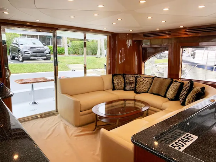 Due South Yacht Photos Pics Luxurious interior of 2002 Hatteras 63 Raised Pilothouse Motor Yacht with plush seating.