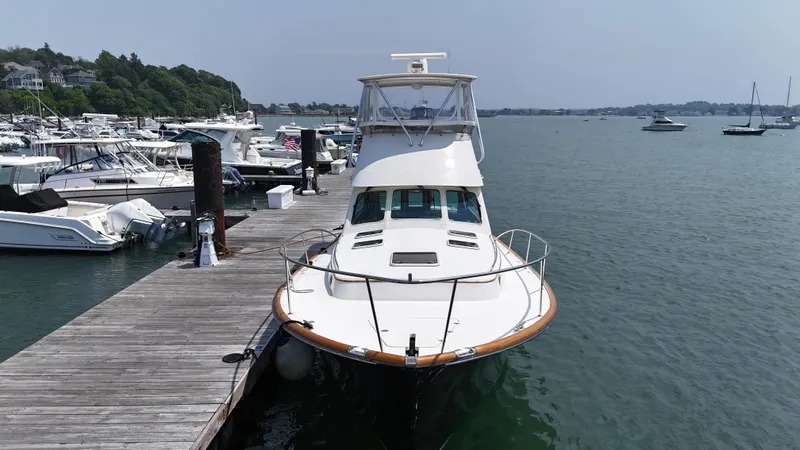 Lady Marion Yacht Photos Pics 2003 Hinckley Talaria 44 FB yacht docked at a marina.