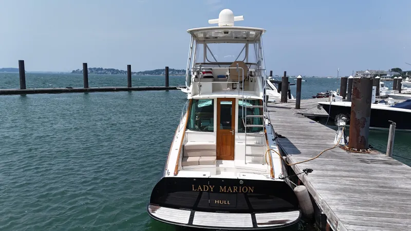 Lady Marion Yacht Photos Pics 2003 Hinckley Talaria 44 FB yacht docked at marina, named "Lady Marion."