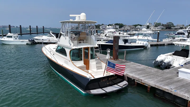 Lady Marion Yacht Photos Pics 2003 Hinckley Talaria 44 FB yacht docked at a marina with other boats.