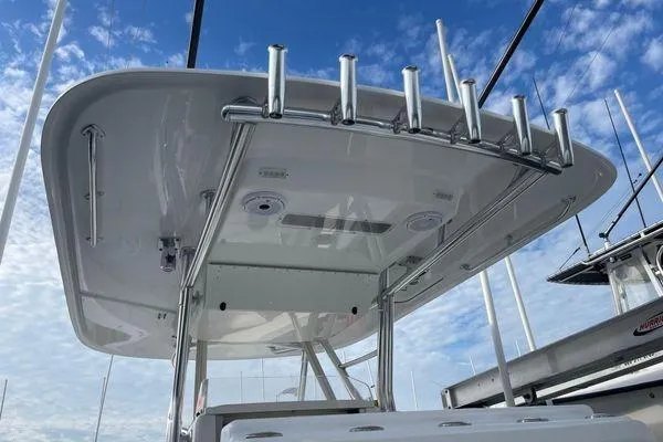 Last Resort Yacht Photos Pics 2013 Bahama 41 Open Fisherman boat with rod holders and T-top under blue sky.