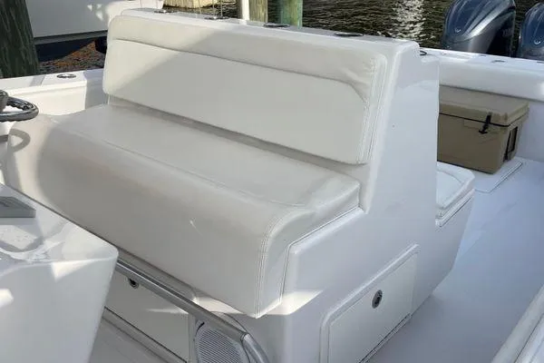 Last Resort Yacht Photos Pics White seating on 2013 Bahama 41 Open Fisherman boat, featuring sleek design and storage.