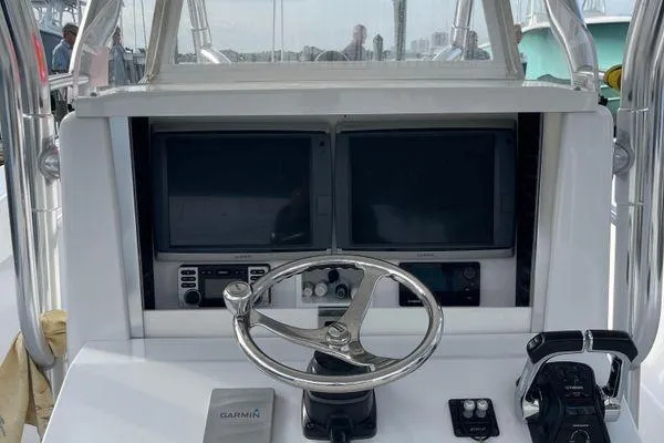 Last Resort Yacht Photos Pics 2013 Bahama 41 Open Fisherman helm with dual screens and steering wheel.
