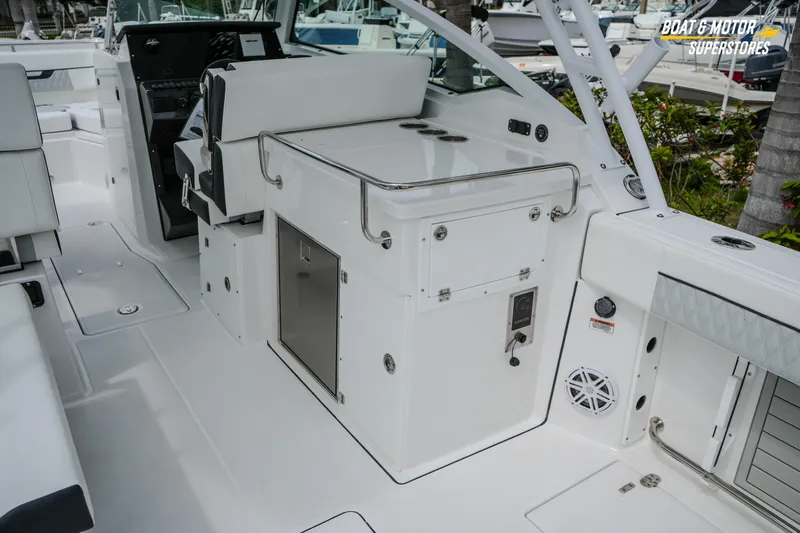  Yacht Photos Pics 2026 Blackfin 272 DC boat interior with seating and storage compartments.