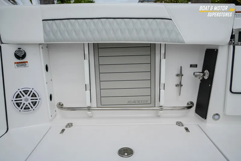  Yacht Photos Pics 2026 Blackfin 272 DC boat interior with speaker and storage compartment.