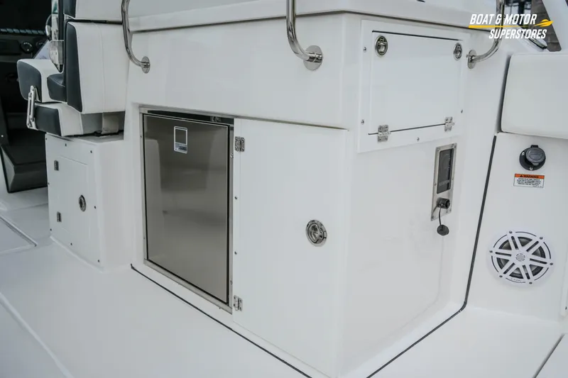  Yacht Photos Pics 2026 Blackfin 272 DC boat interior with storage compartments and seating.