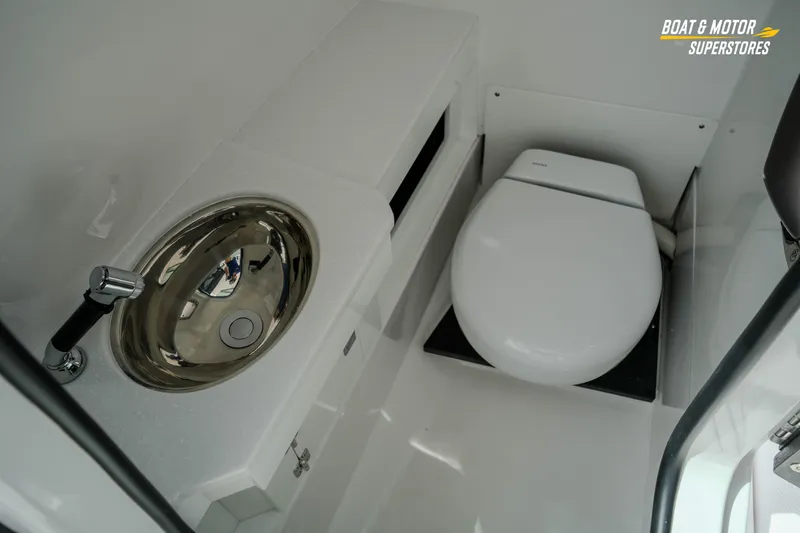  Yacht Photos Pics 2026 Blackfin 272 DC boat interior with modern toilet and stainless steel sink.