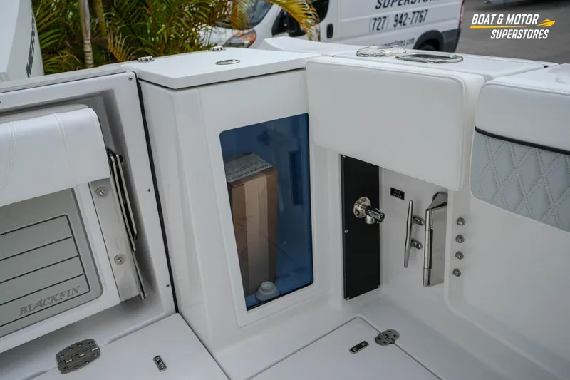  Yacht Photos Pics Interior view of 2026 Blackfin 272 DC boat, showcasing storage compartments and sleek design.