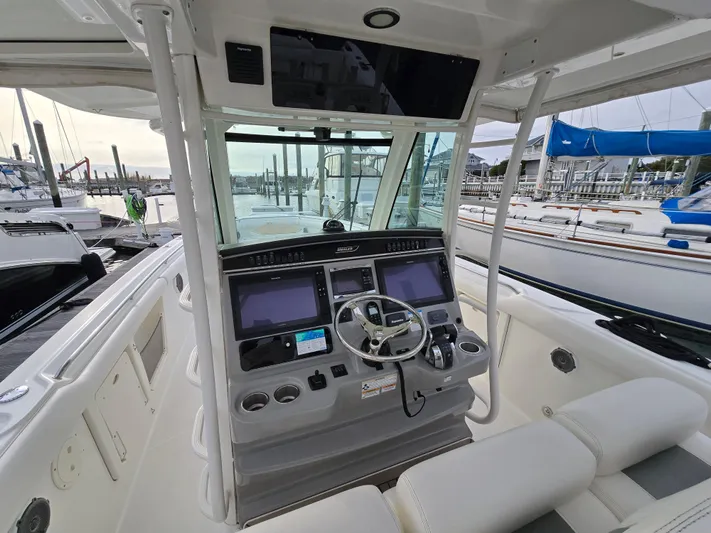  Yacht Photos Pics 2015 Boston Whaler 350 Outrage helm with dual screens at marina.