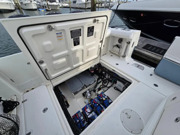  Yacht Photos Pics 2015 Boston Whaler 350 Outrage boat with open hatch showing engine compartment.