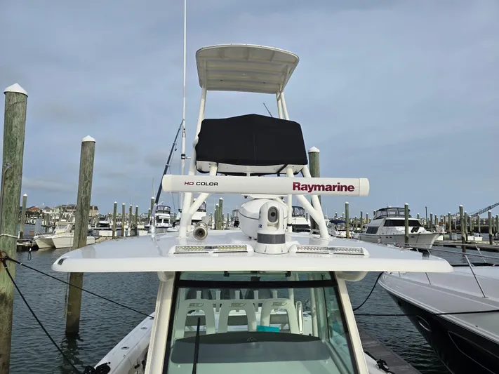  Yacht Photos Pics 2015 Boston Whaler 350 Outrage with Raymarine equipment docked at a marina.