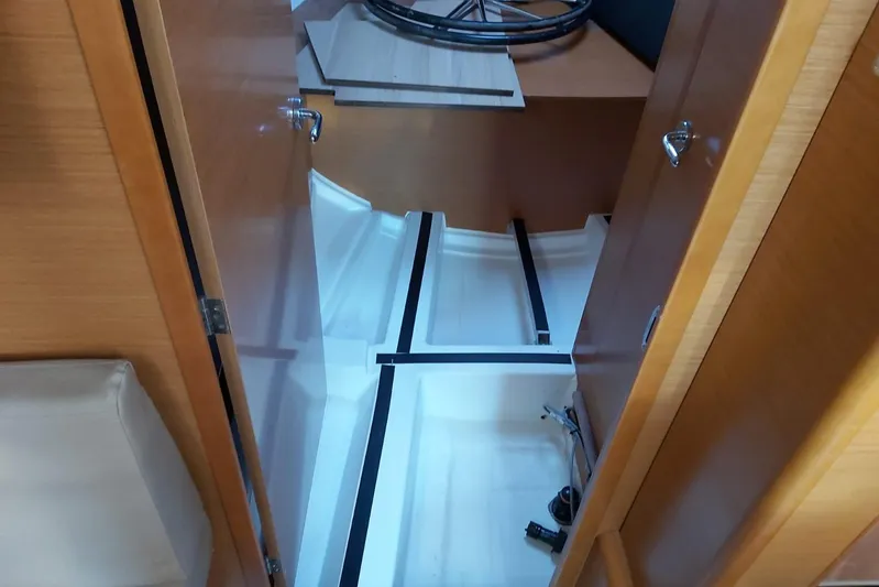  Yacht Photos Pics Interior view of 2013 Jeanneau Sun Odyssey 409 sailboat, showcasing storage compartment.