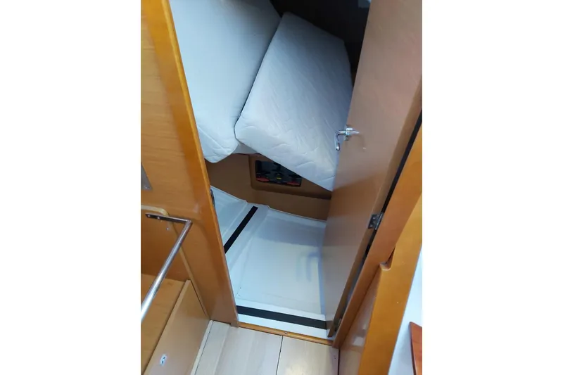  Yacht Photos Pics Interior cabin view of 2013 Jeanneau Sun Odyssey 409 sailboat, featuring a cozy bed.